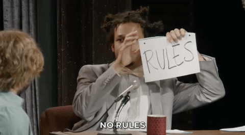 Gif of Eric Andre ripping a piece of paper with the word, "rules," written on it.